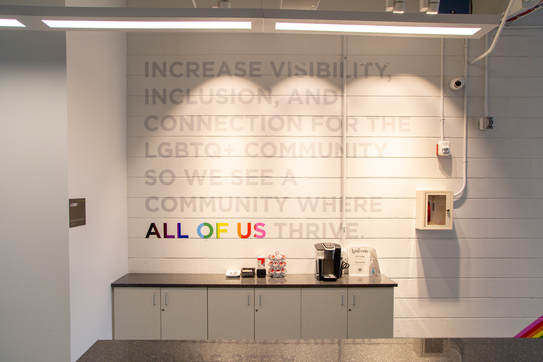 An inspirational message affirms Stonewall's welcoming and accepting mission at Stonewall Columbus Community Center by Continental Office Branding