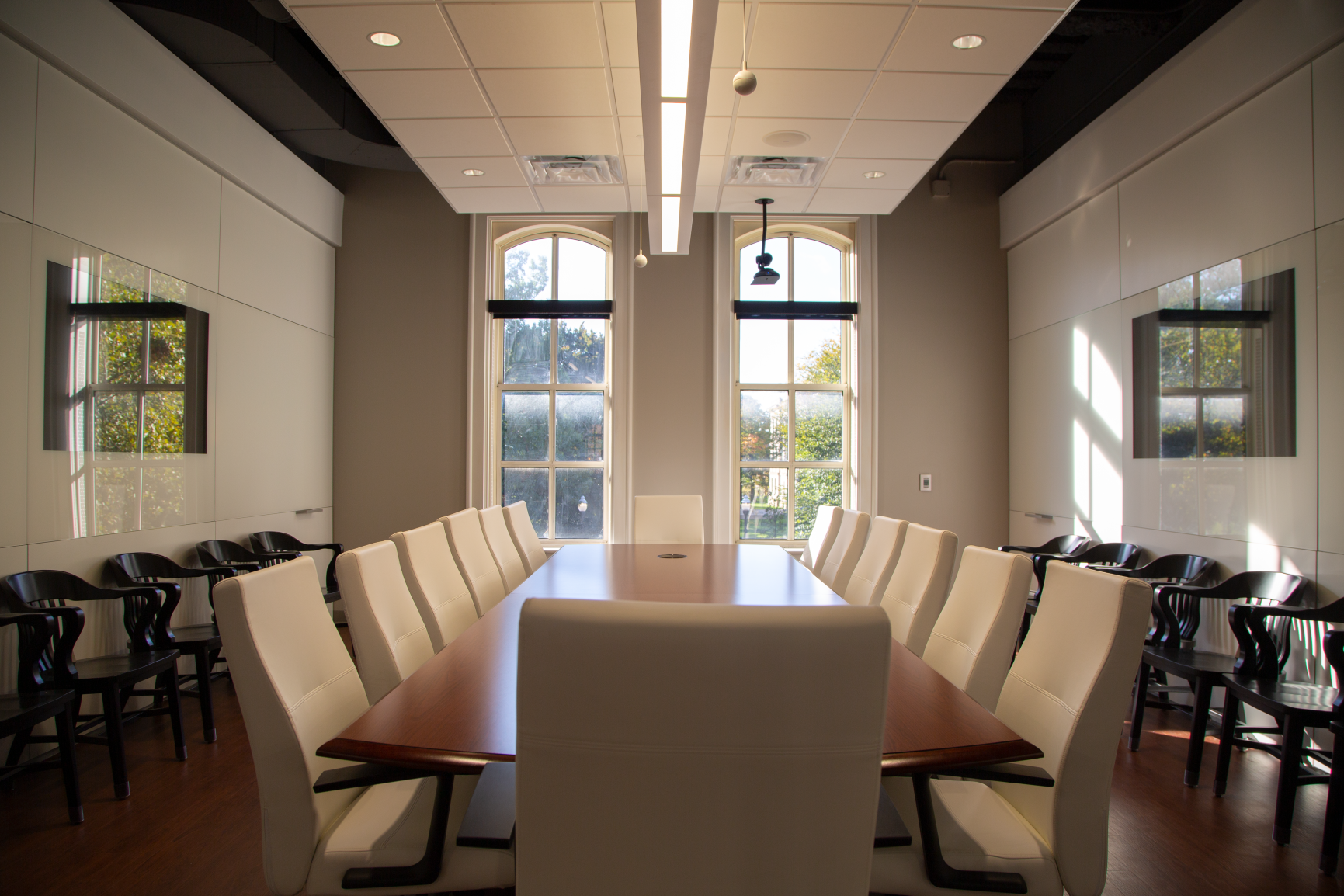 Modern, ergonomic chairs meet timeless, traditional style in this large conference room.