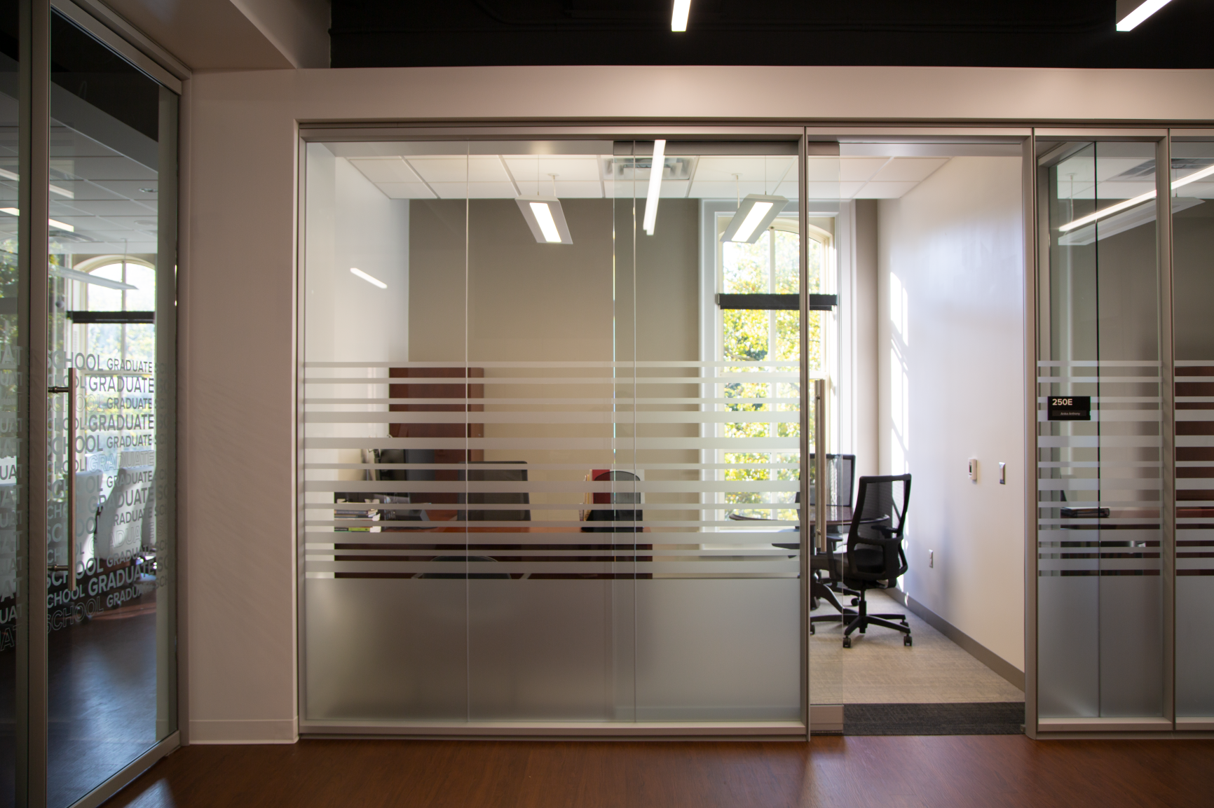 A closer look into a private office with sliding glass doors.