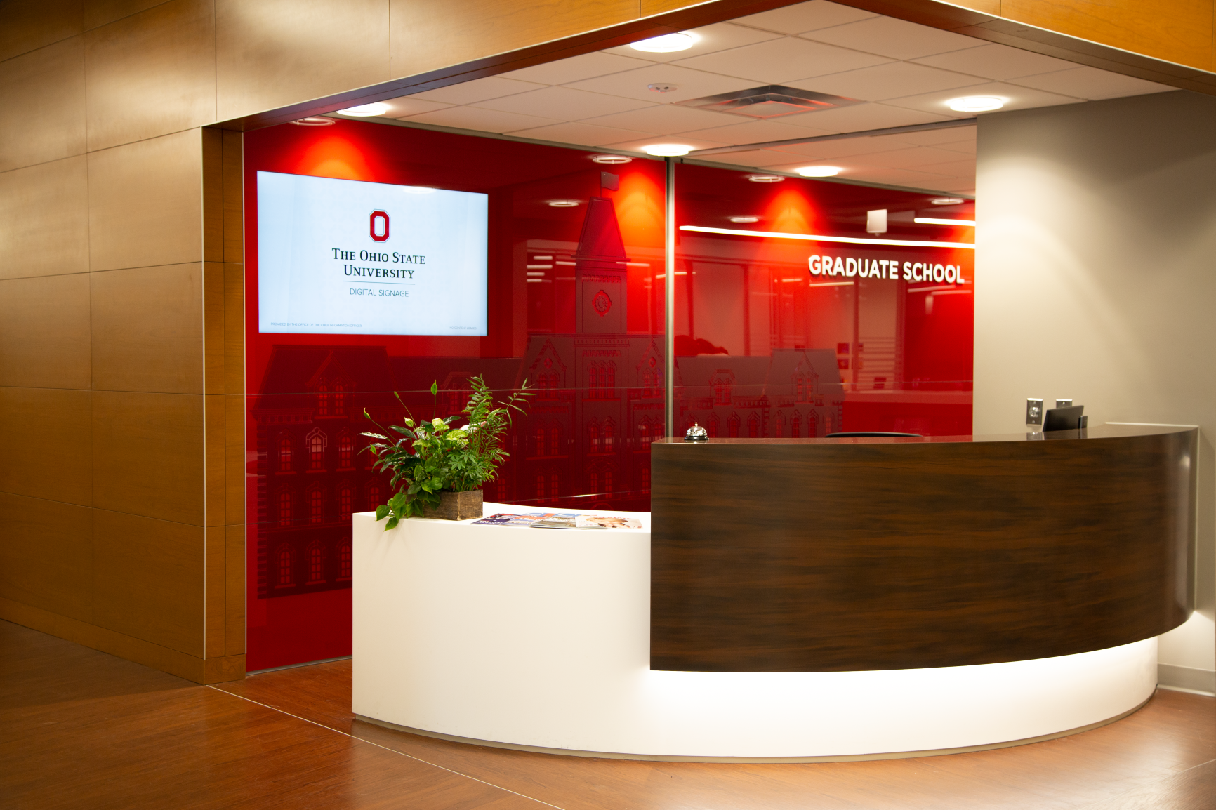 Custom DIRTT applications with integrated technology and custom branding greets guests at the Graduate School in University Hall at The Ohio State University by Continental Office