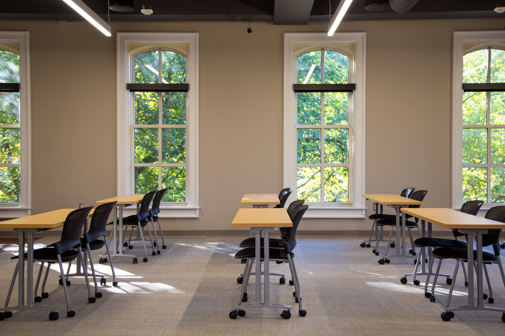 Casters for both tables and chairs give this space the flexibility to be easily arranged in any number of configurations!